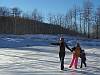 Playing on Frozen Pond in Winter