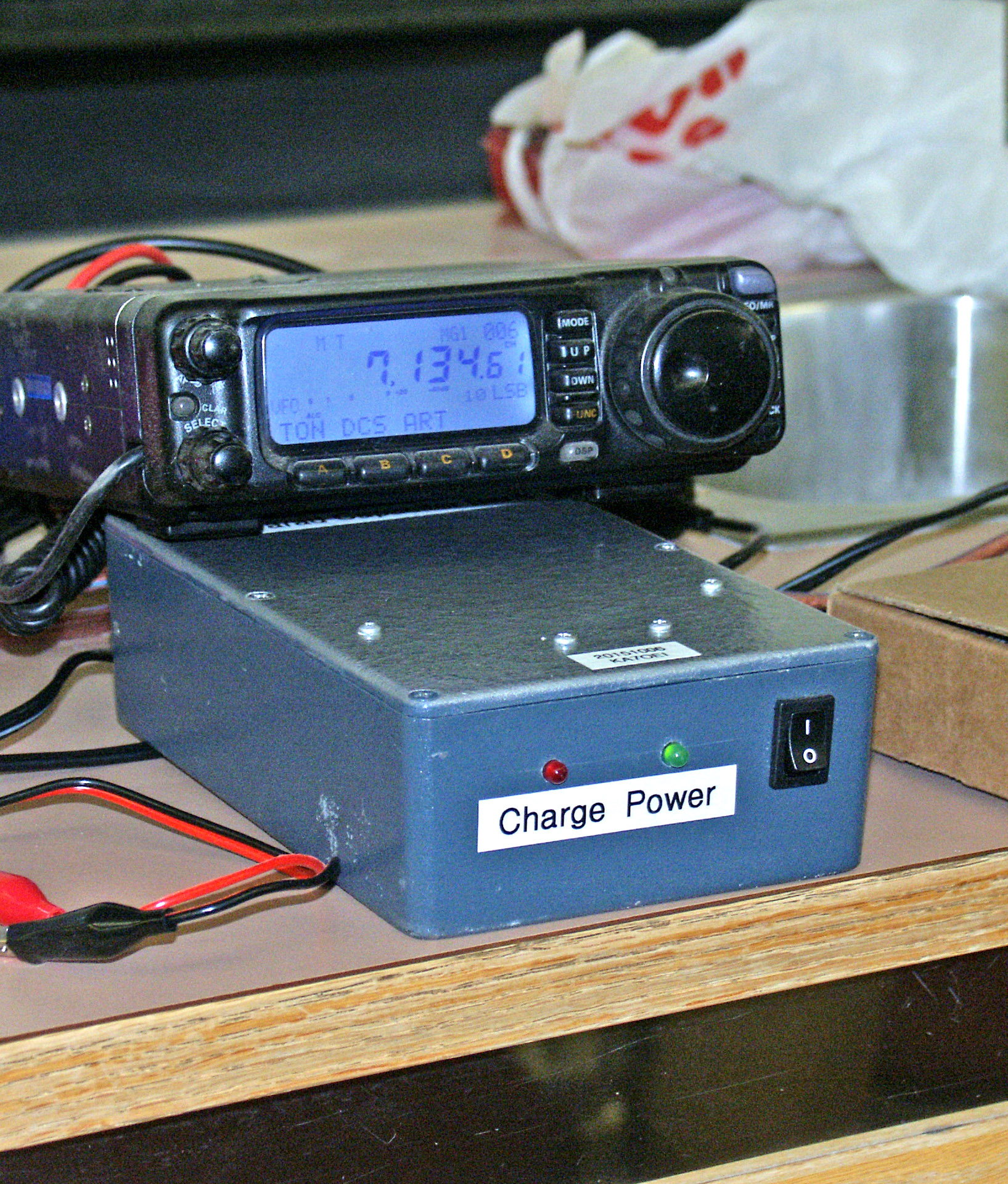 Metal box with
 power switch, pilot lights, and “Charge Power” label
