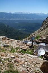 Deirdre at the waterfall, with sawtooth valley and the white clouds [thu jul 2 12:06:43 mdt 2015]