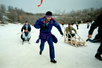 Adult Scout leaders and a Klondike Derby sled